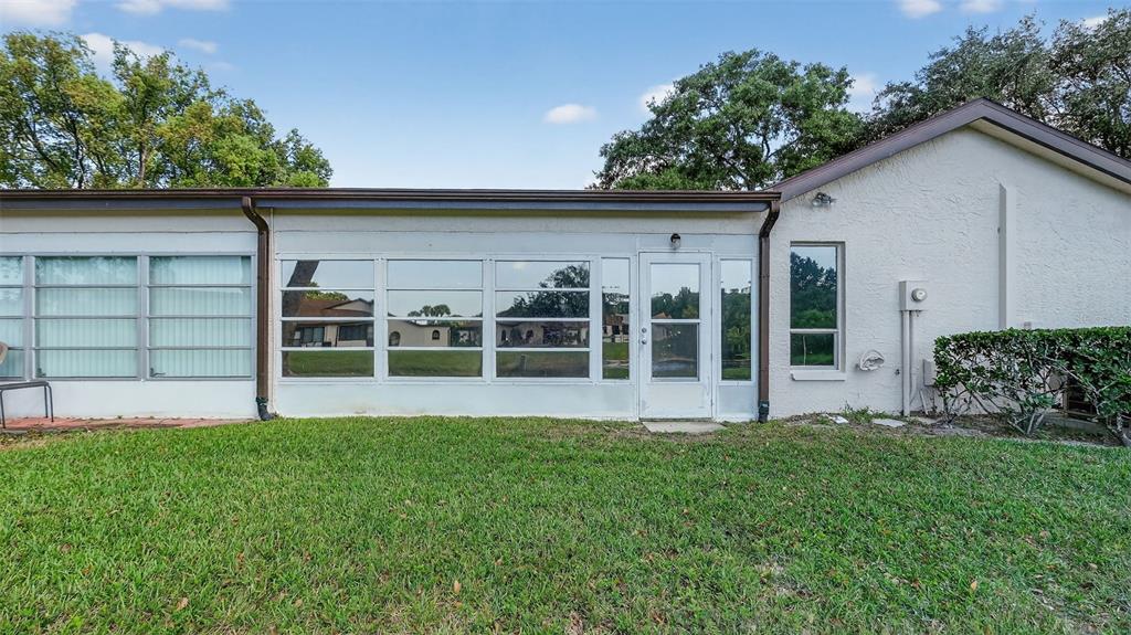 7280 Scotland Circle Weeki Wachee, FL 34613 - Photo 6 of 42 a view of house with backyard and garden