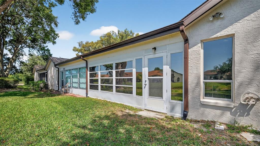 7280 Scotland Circle Weeki Wachee, FL 34613 - Photo 7 of 42 a view of a house with a yard and sitting area