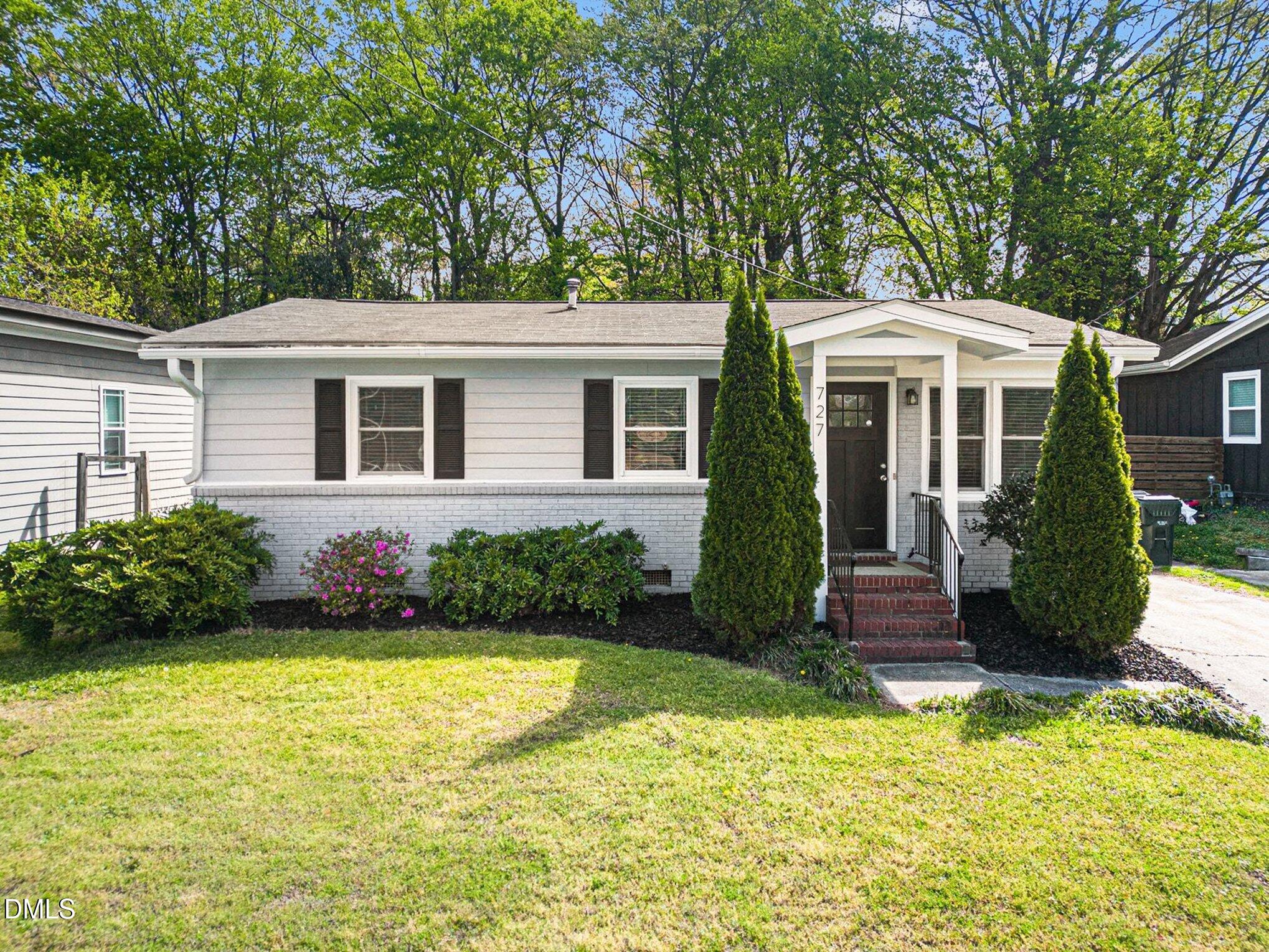727 South State Street Raleigh, NC 27601 - Photo 28 of 30 a front view of a house with garden
