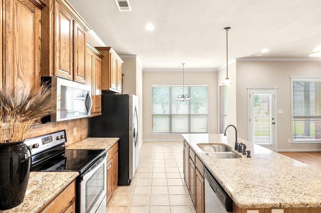 1852 Meadowview Canton, TX 75103 - Photo 10 of 28 a kitchen with granite countertop lots of counter top space and stainless steel appliances