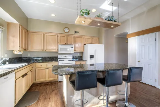 a kitchen with lots of counter top space and appliances