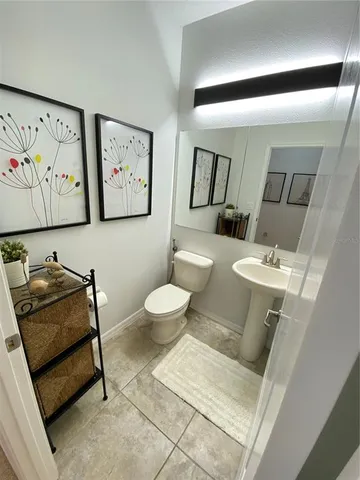 a living room with a flat screen tv and a fireplace