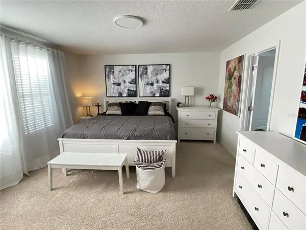 a view of a livingroom with furniture and a flat screen tv
