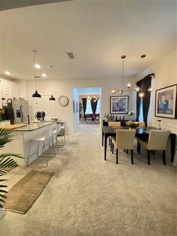 a view of a dining room with furniture