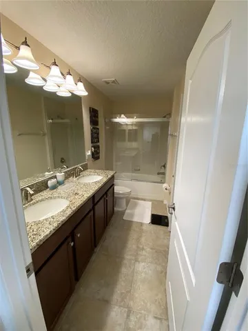 a room with furniture and painting on wall