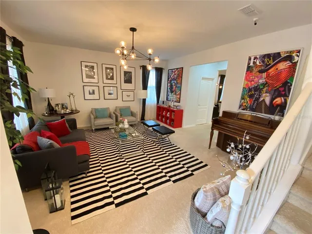 a bedroom with furniture and a chandelier