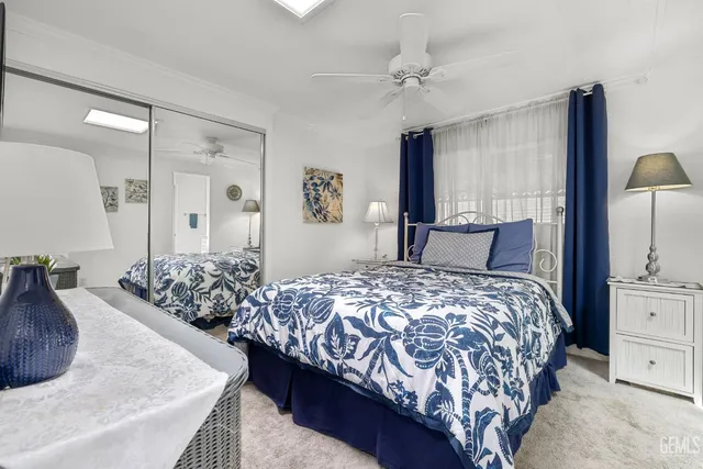 a bedroom with a large bed and a dresser