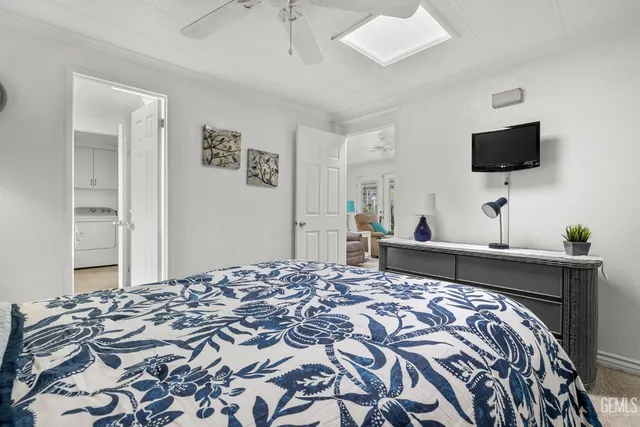 a bedroom with a bed and flat screen tv