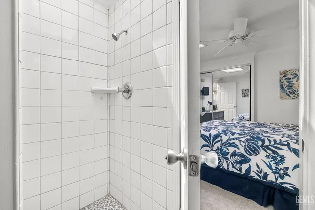 a bathroom with a bathtub and shower