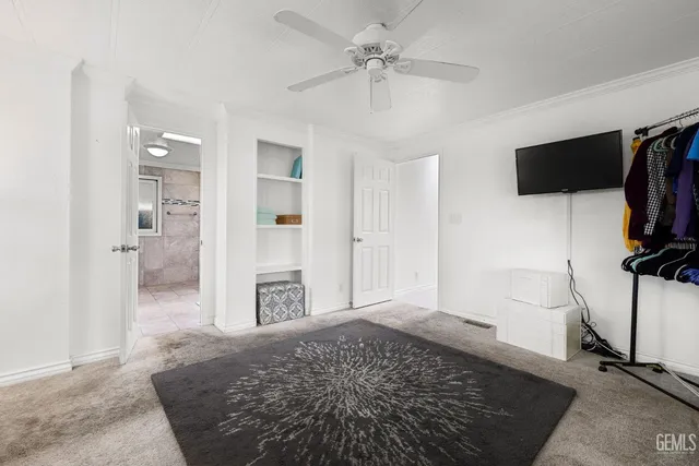 a view of a livingroom with furniture and a flat screen tv