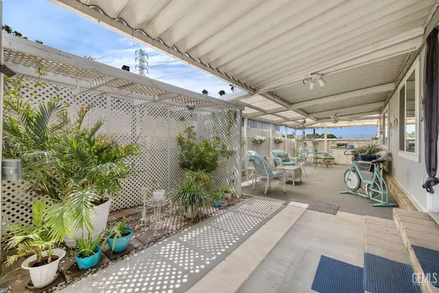 a couple of flower plants in front of door