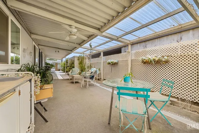 a view of a patio with table and chairs