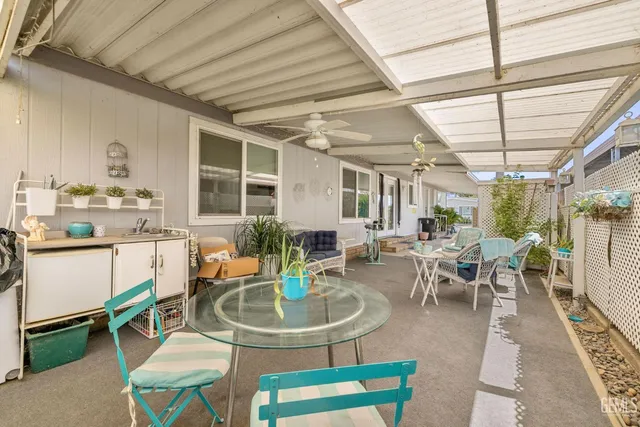 a living room with lots of furniture and a table