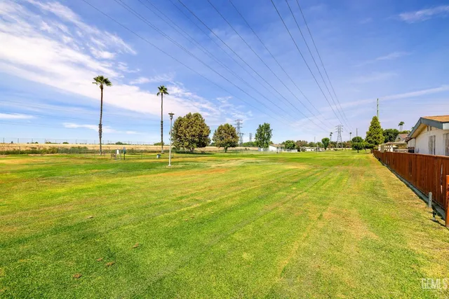a view of a swimming pool with an outdoor space and seating area