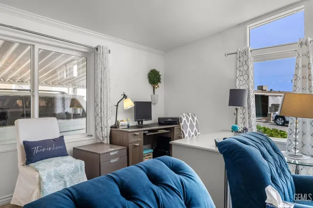 a living room with furniture and a lamp