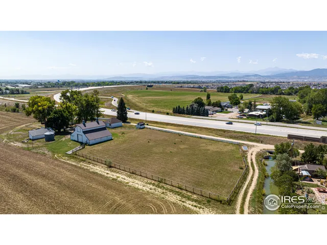 a view of a swimming pool and an outdoor seating
