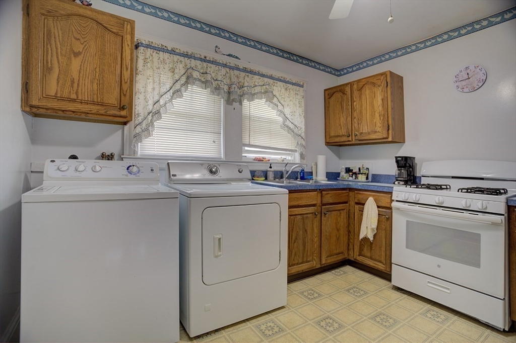 44 Cottage Park Road Winthrop, MA 02152 - Photo 16 of 39 a utility room with sink dryer and washer