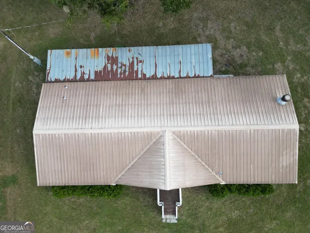 a view of outdoor space with wooden fence