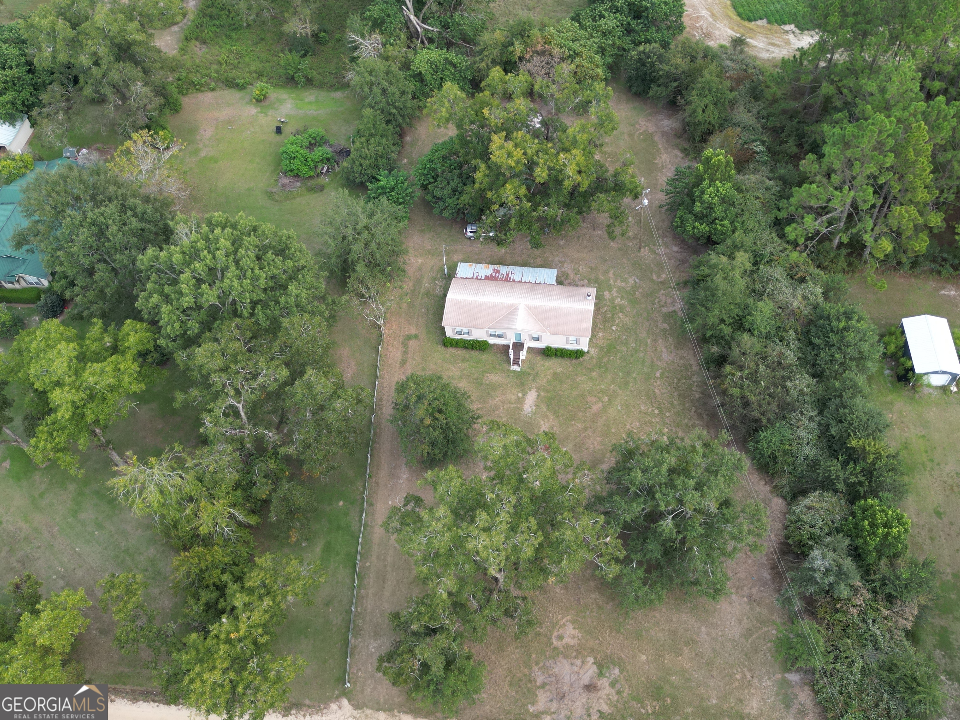 693 Old Quitman Annex Road Adel, GA 31620 - Photo 7 of 30 an aerial view of a house with a yard