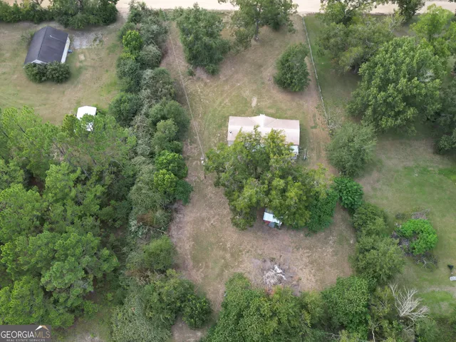 an aerial view of a house with yard and outdoor space