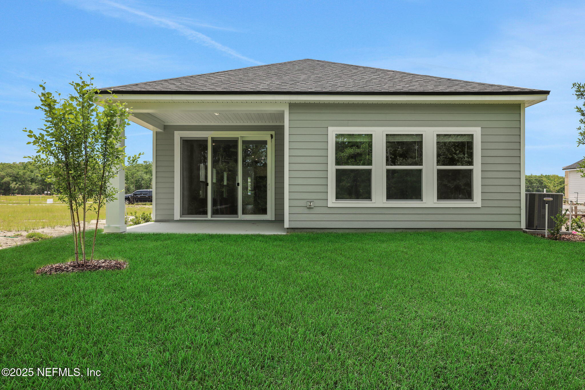 191 Bluegrass Way St. Augustine, FL 32092 - Photo 3 of 62 front view of a house with a yard