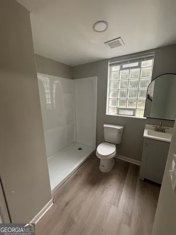 a bathroom with a toilet a sink and a bathtub