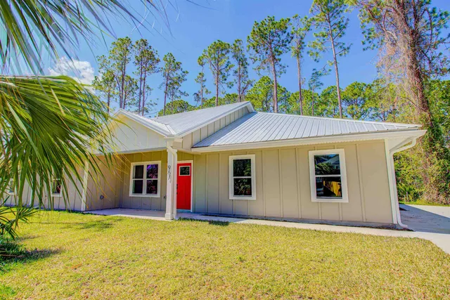 a view of an empty room and wooden floor