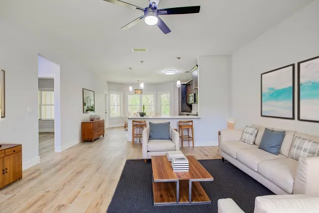 a view of a porch with wooden floor and a yard