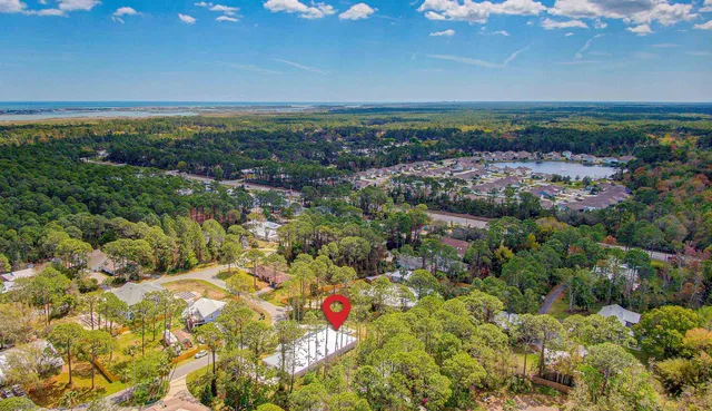 a view of a house with pool and yard