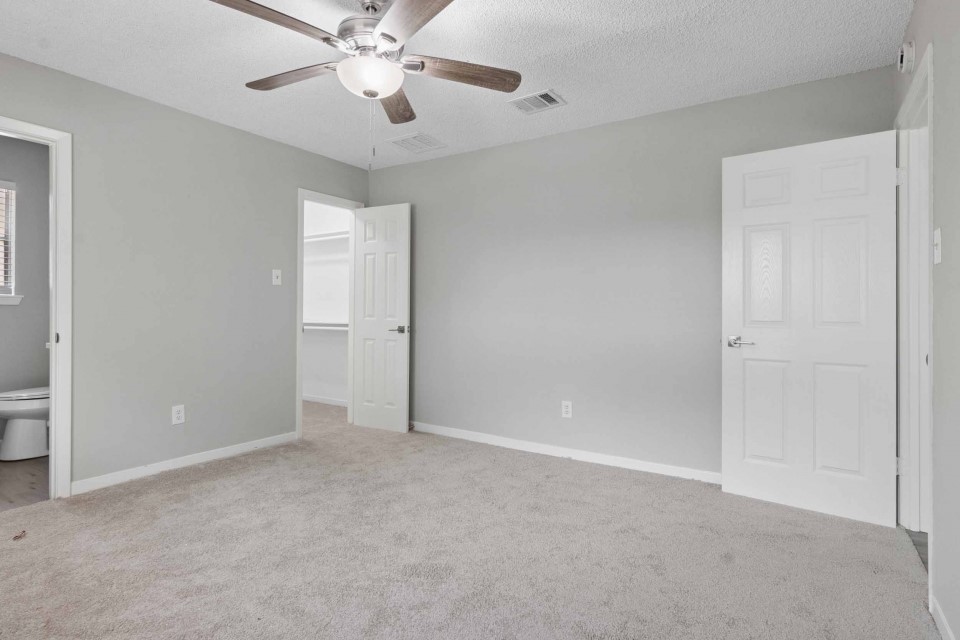 7403 Strawbridge Lane Houston, TX 77040 - Photo 11 of 22 a view of an empty room and chandelier fan