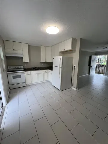 a view of backyard space and trees