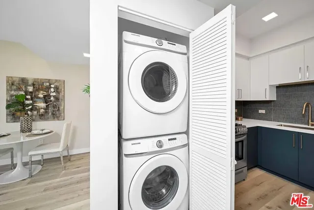 a view of a kitchen with washer and dryer