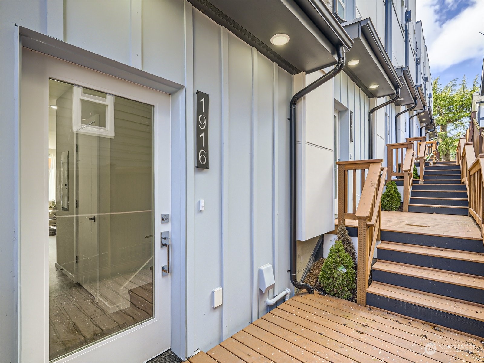 a view of a house with wooden floor and a balcony view