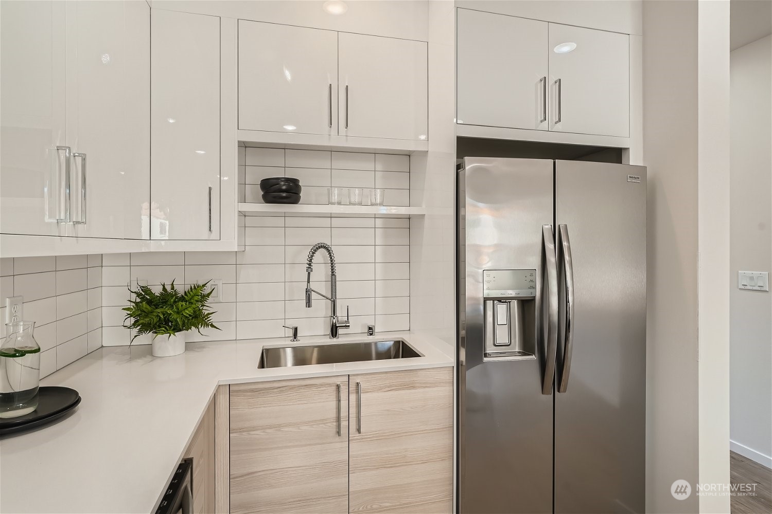 1916 South Grand Street Seattle, WA 98144 - Photo 11 of 26 a kitchen with stainless steel appliances granite countertop a refrigerator a sink and white cabinets