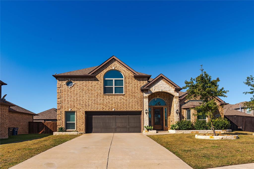1008 Hummingbird Court Forney, TX 75126 - Photo 33 of 34 a front view of a house with yard