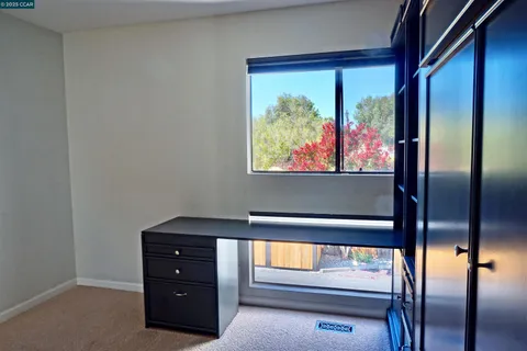 a view of room with furniture and window