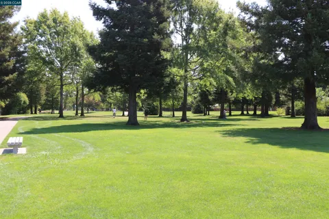 a view of a door and chair in the kitchen