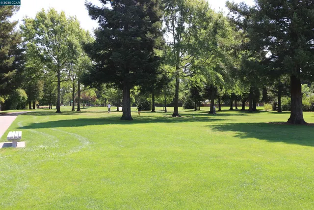 a view of a door and chair in the kitchen