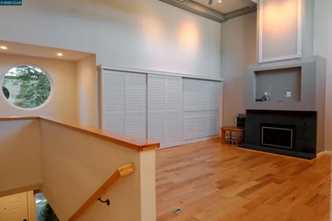 a view of an empty room with a fireplace