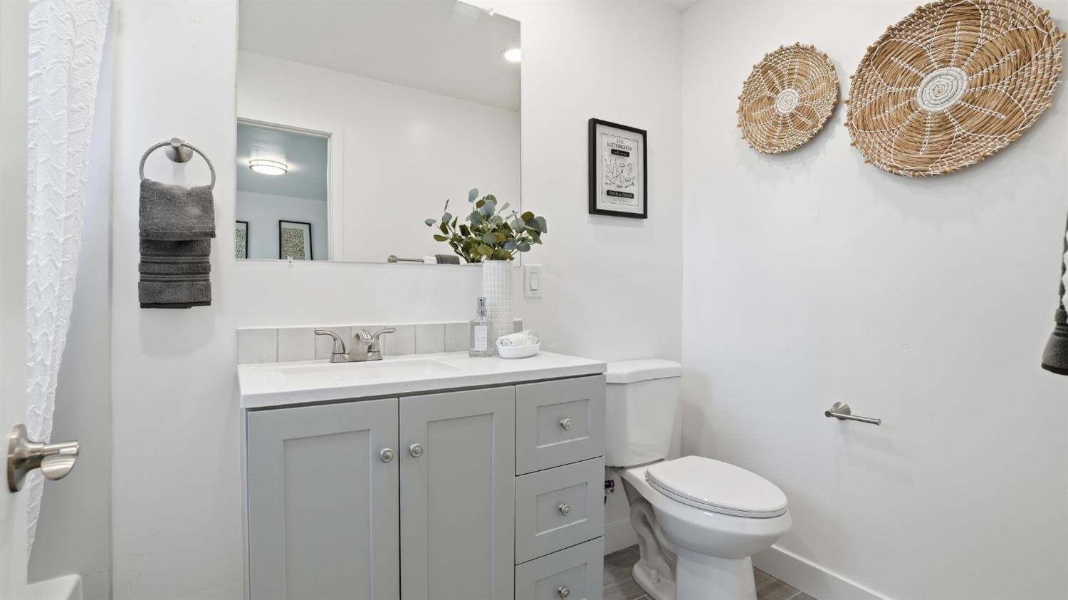 6741 Big Sandy Lane Placerville, CA 95667 - Photo 13 of 25 a bathroom with a toilet sink and mirror