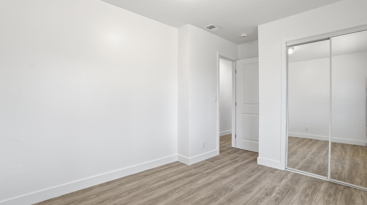 6741 Big Sandy Lane Placerville, CA 95667 - Photo 14 of 25 a view of an empty room with wooden floor