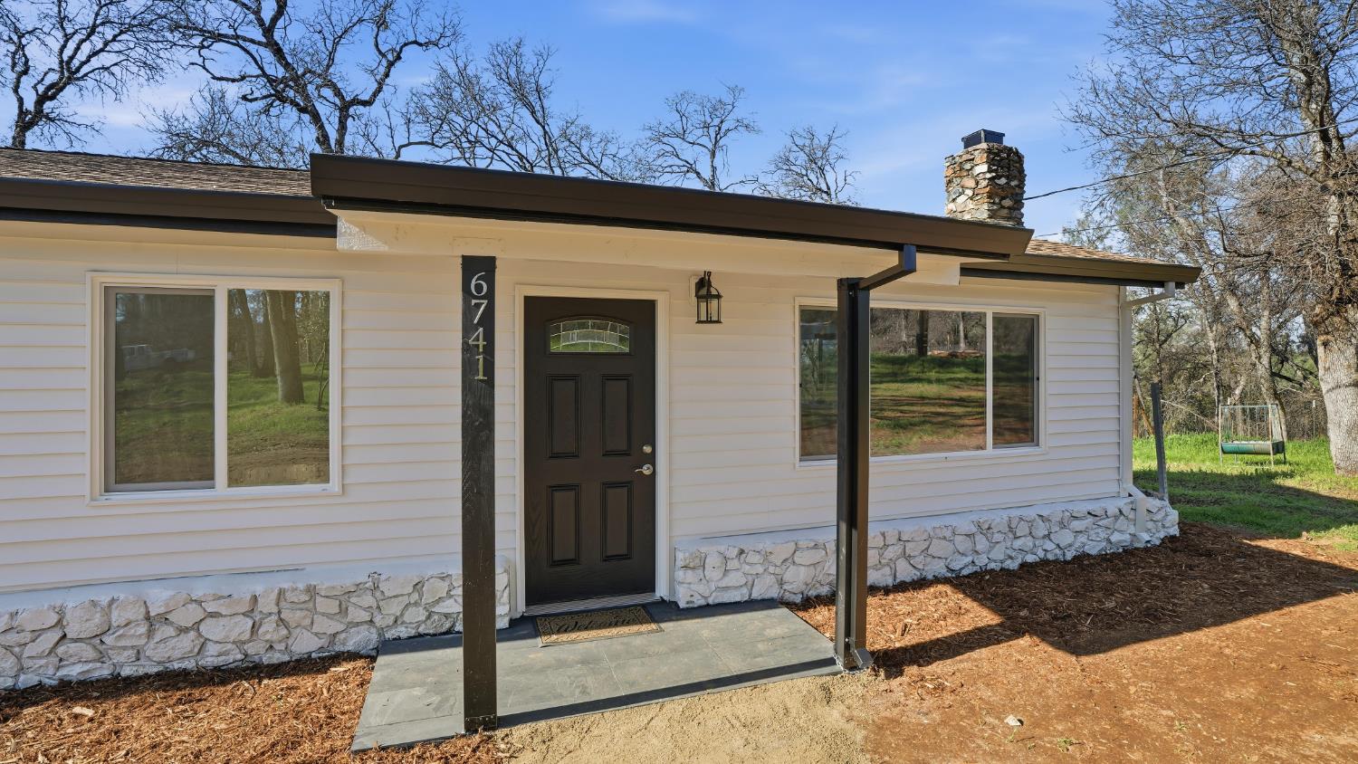 6741 Big Sandy Lane Placerville, CA 95667 - Photo 22 of 25 a view of a house with a yard