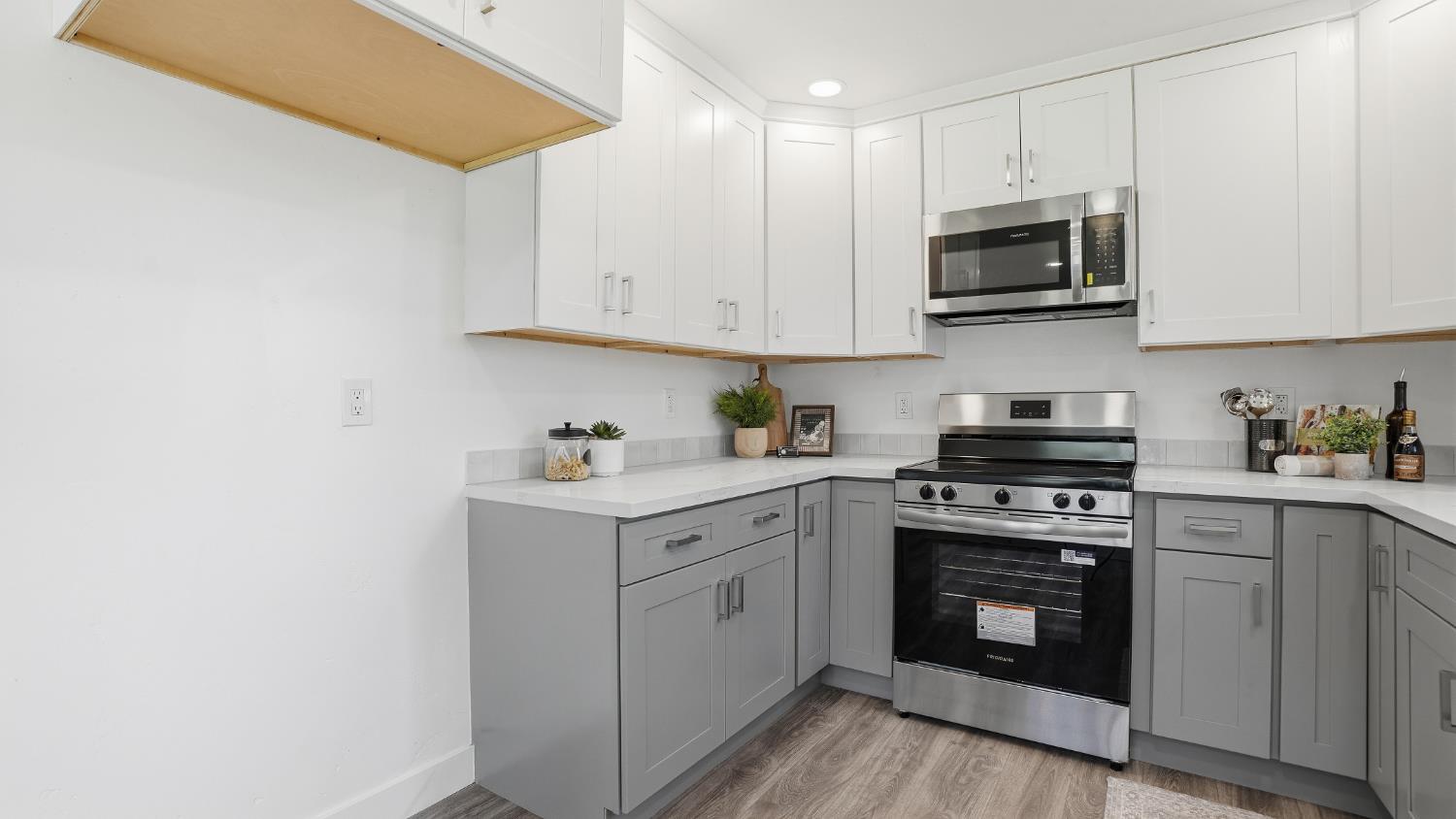 6741 Big Sandy Lane Placerville, CA 95667 - Photo 3 of 25 a kitchen with white cabinets stainless steel appliances and sink