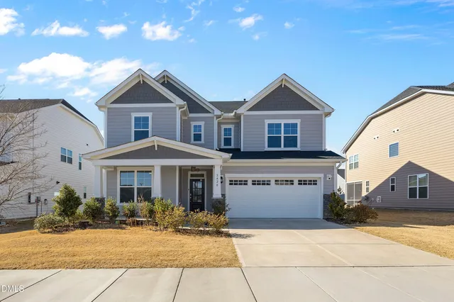 a front view of a house with yard