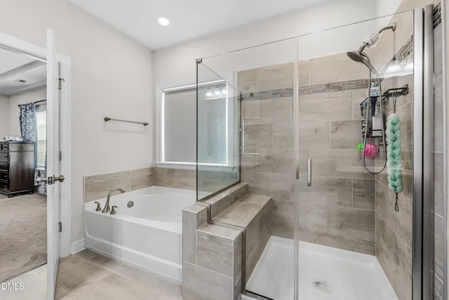 a bathroom with a bathtub and a shower