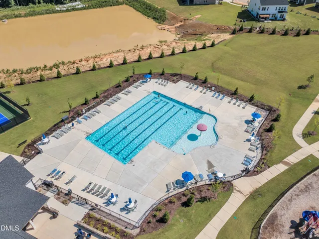 an aerial view of a house with outdoor space