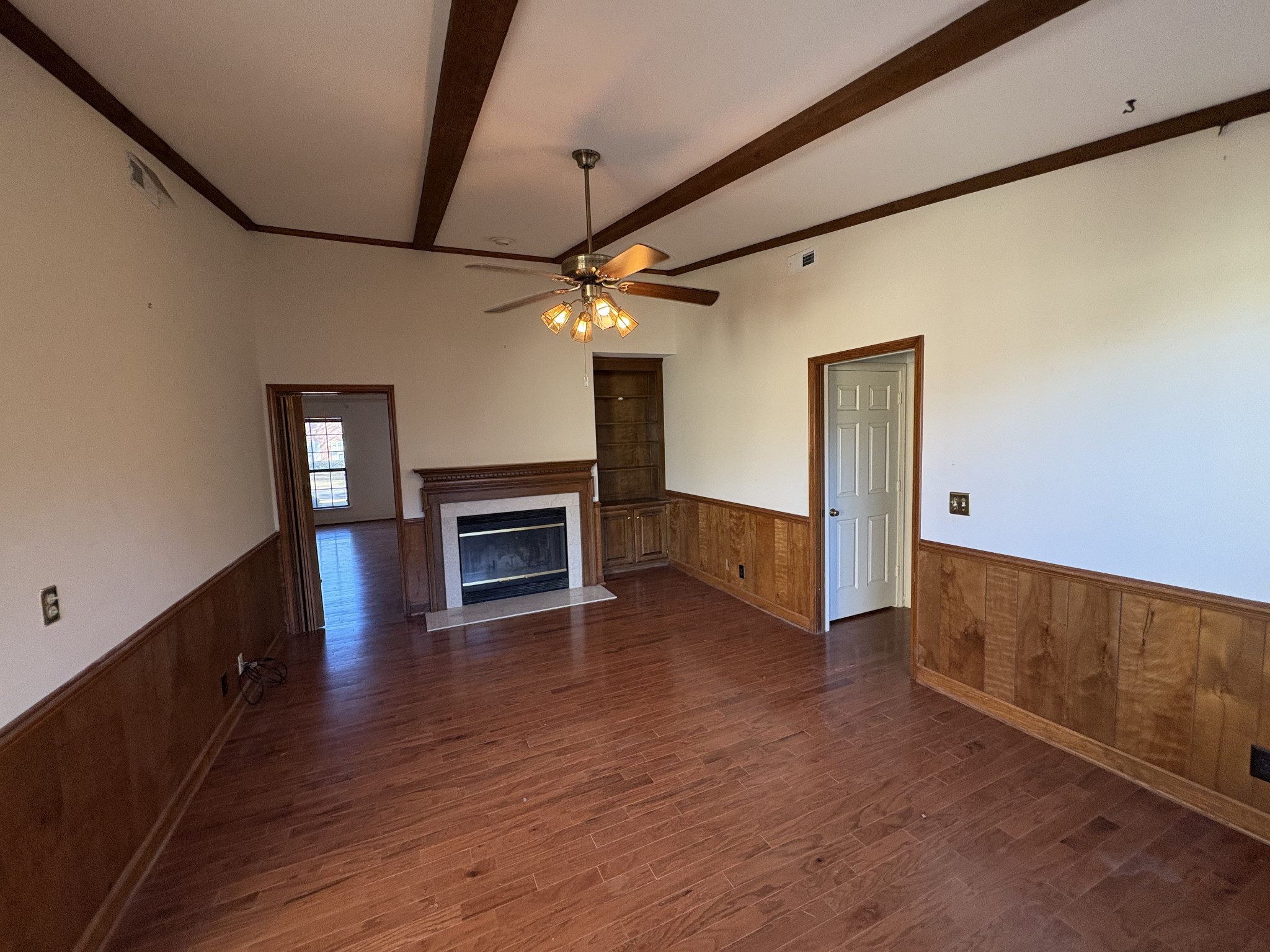 710 General George Patton Road Nashville, TN 37221 - Photo 5 of 18 a view of a livingroom with wooden floor fireplace and staircase