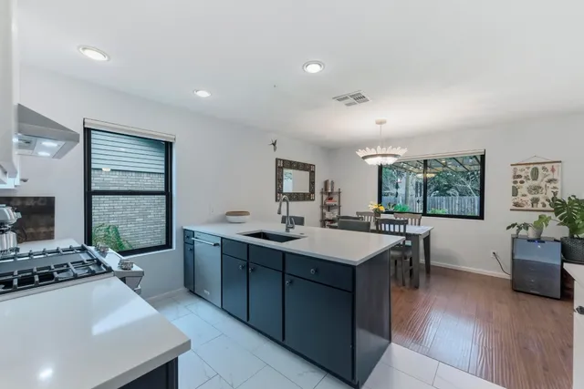 a kitchen with a sink and stove