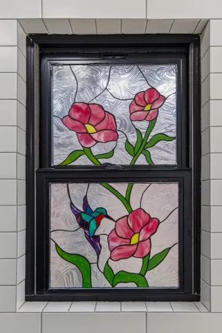 a room that has a painting on the wall and a painting on the wall