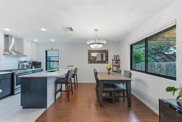 a view of a dining room with furniture window and wooden floor